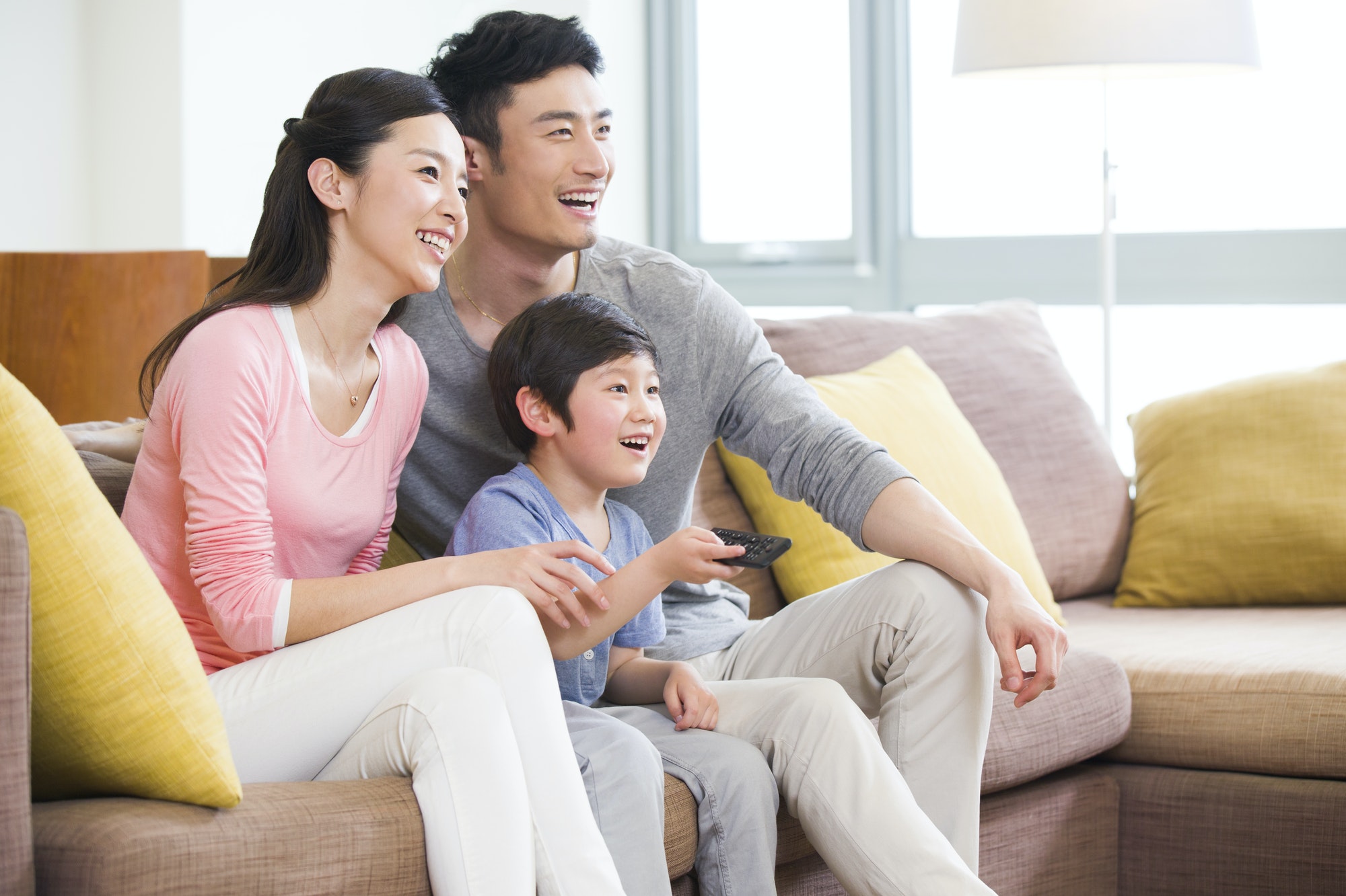 Happy family watching TV